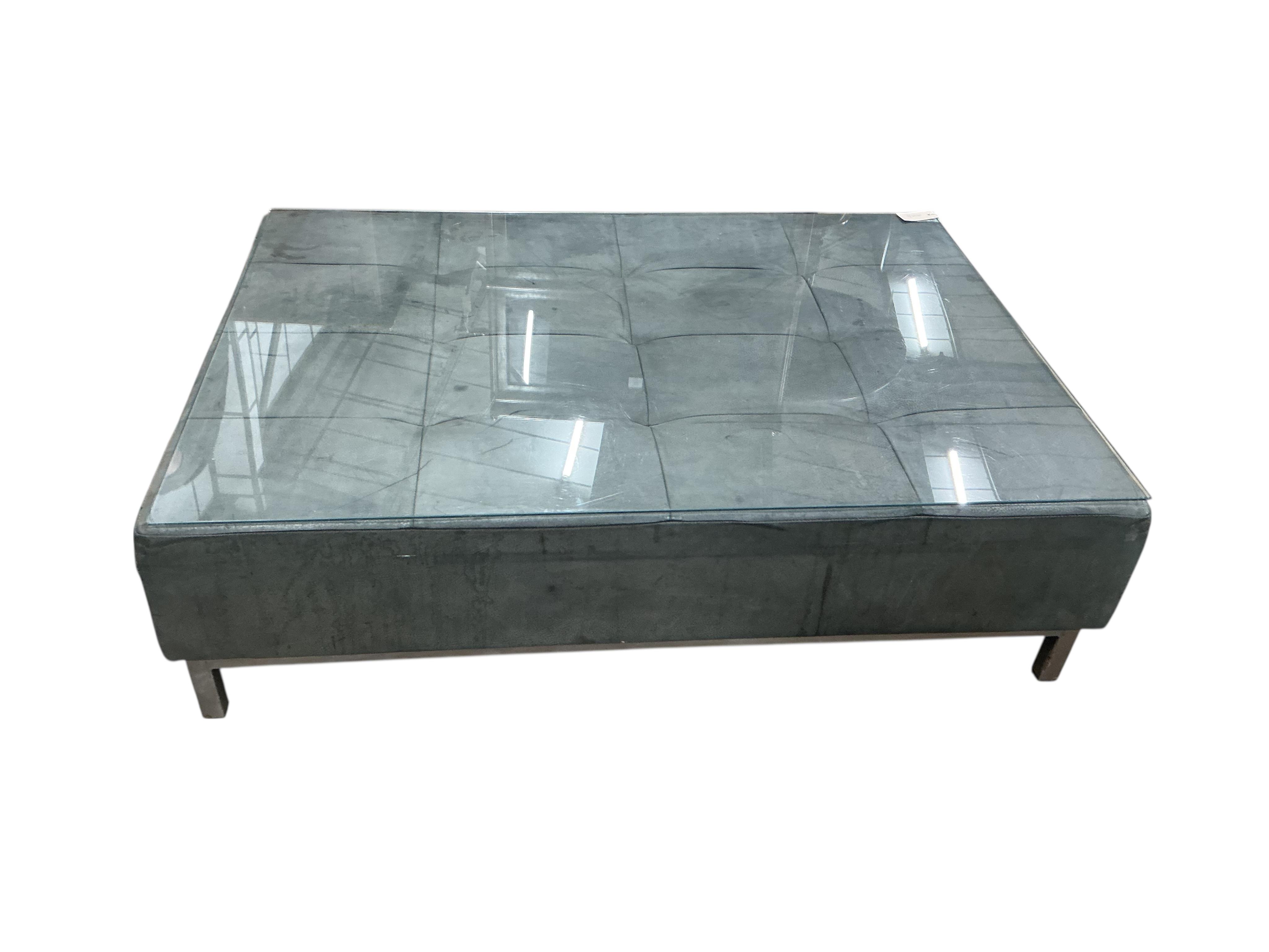 A contemporary leather rectangular ottoman stool with plate glass top, width 124cm, depth 88cm, height 34cm